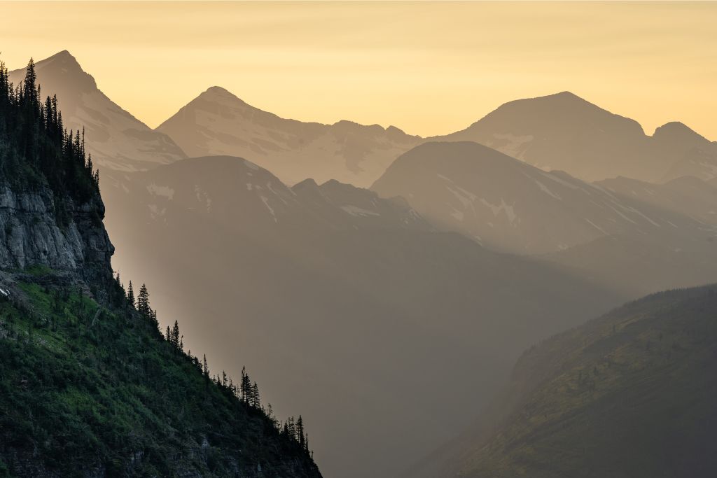 The setting sun turns to dusk at Apgar Lookout in Glacier National Park