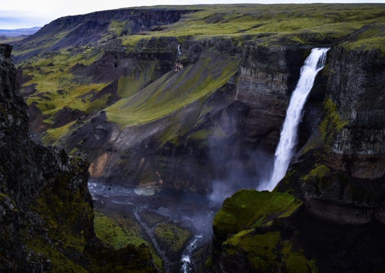 Plan your Iceland elopement overlooking a dramatic waterfall