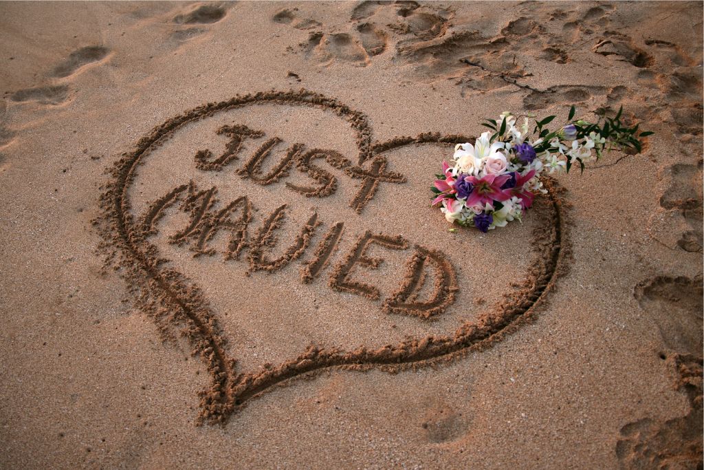 You can write "Just Married" in the sand like this picture after your Maui beach wedding ceremony