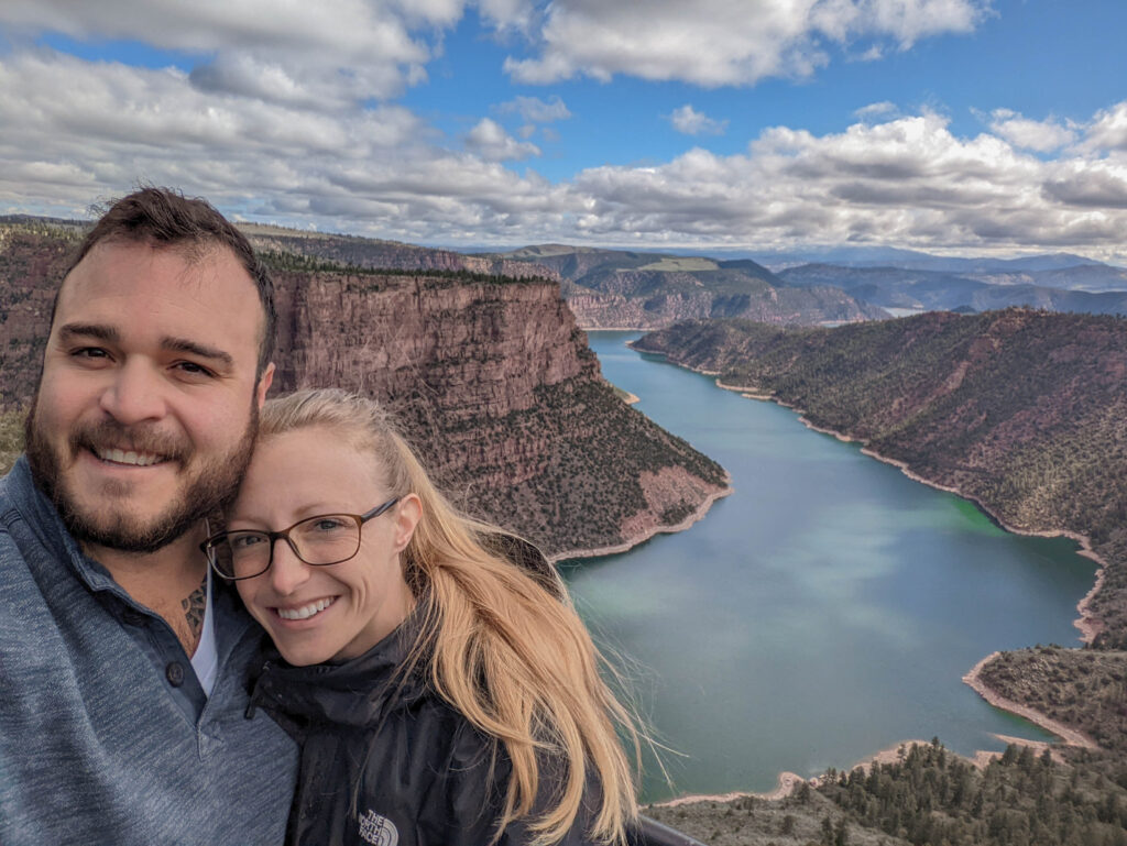 Mike and Laura standing in front of Flaming Gorge in Utah, a perfect elopement location.